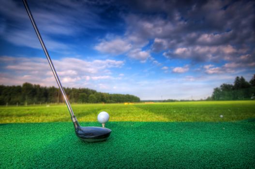 Playing golf. Golf club and ball. Preparing to shot