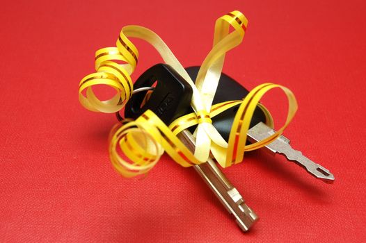 Car keys on red background