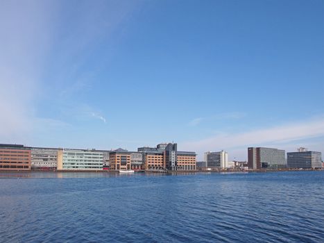 COPENHAGEN - MAR 16: View of modern commercial and business buildings across the canal in Central Copenhagen, Denmark on March 16, 2013.
