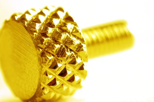Yellow screw close-up. Conceptual image 