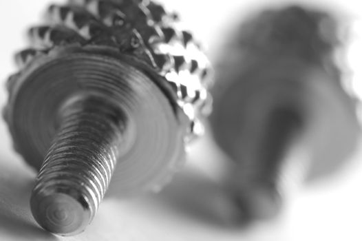 Chrome screw close-up. Conceptual image