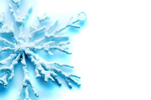 Frosty snowlake Christmas decoration on white background