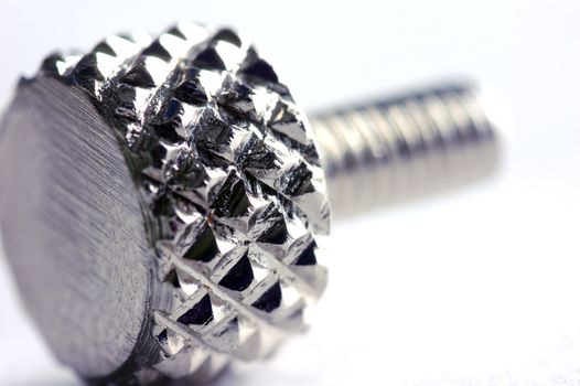 Chrome screw close-up. Conceptual image 