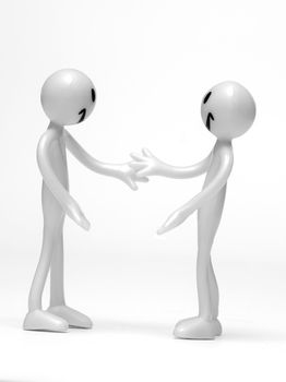 Business handshake by two figures. Conceptual