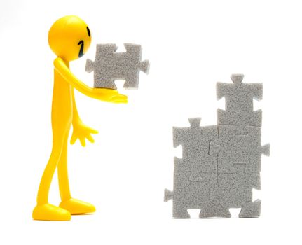 Putting pieces of puzzles together. Conceptual image