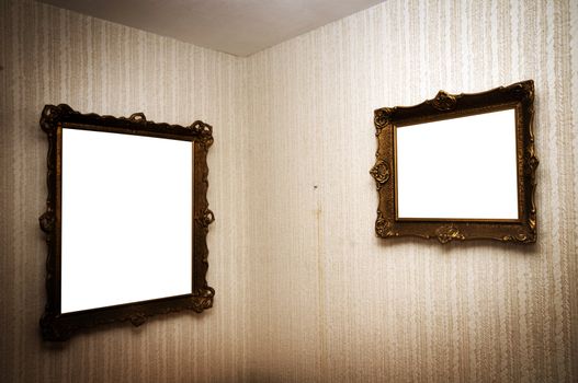 Old ornamented frames on retro grunge wall