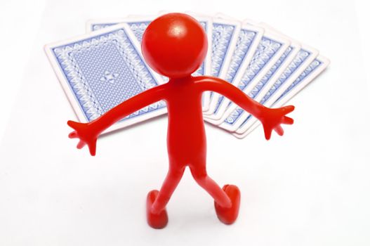 Playing cards and red human figure  