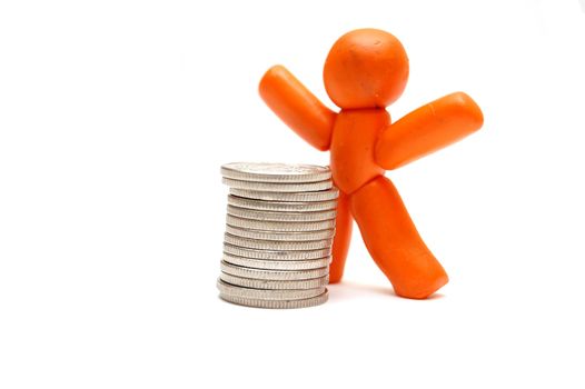 Plasticine figure staying in front of coins pile. Winner in business