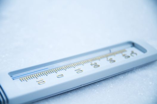 Below zero. Thermometer indicating minus temperature in cold winter.