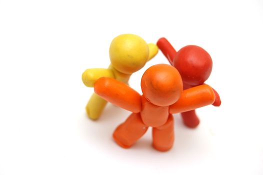 3 plasticine figures staying together and celebrating