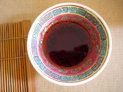 a plate of soya sauce serving with meal, asian style 