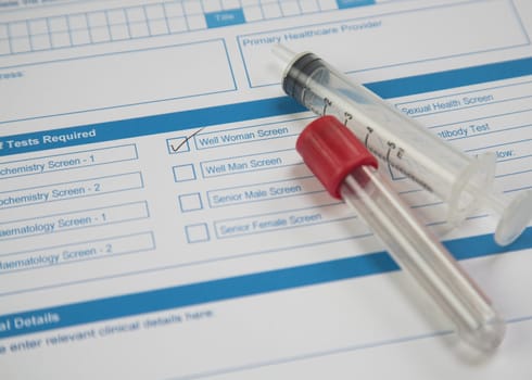 A pathology request form ticked for Well Woman Screen with syringe and blood tube.