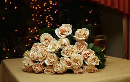 Bunch of fresh roses on a table in an interior of restaurant