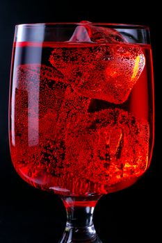Glass of red drink with ice closeup (C4)