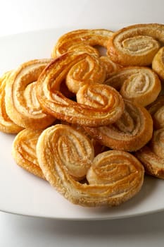 Heart shaped puff pastry in a dish (vertical)