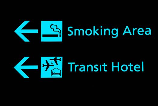 View of airport signs in black background