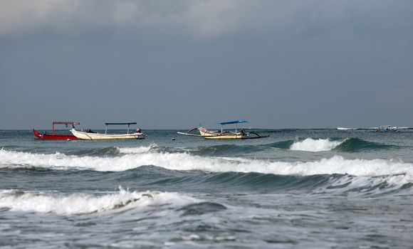 Three  boats anchored in the water
