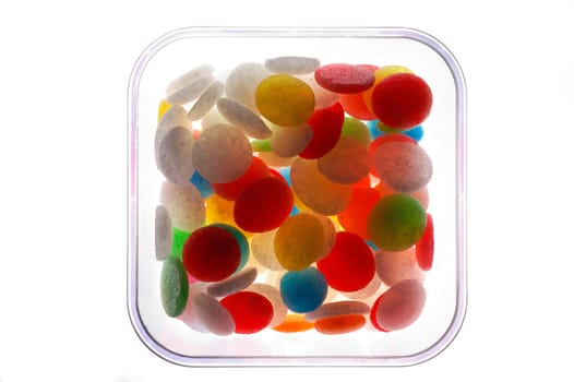 Candies in glass jar backlit with clipping path