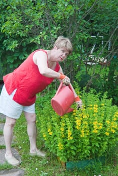Woman watering flowers