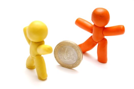 2 plasticine figures staying in front of each other. Competition in business
