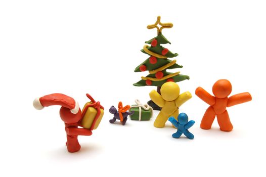 Plasticine figures staying together and celebrating christmas time, Santa Clous giving away presents