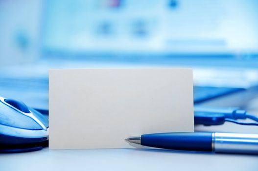 Modern business workplace and blank card for message