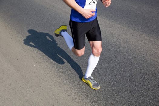 Marathon runner on the way. Running, a healthy exercise