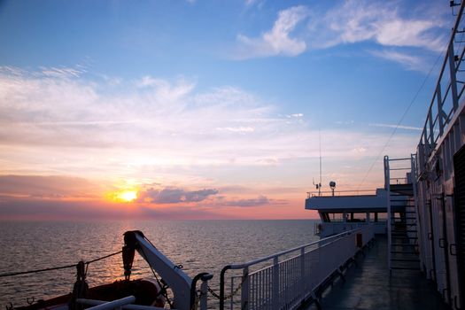Ship deck, board view. Ocean, sea at sunset