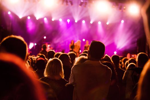 Crowds of people having fun on a music concert