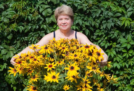 Senior woman with flowers