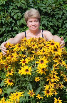 Senior woman with flowers