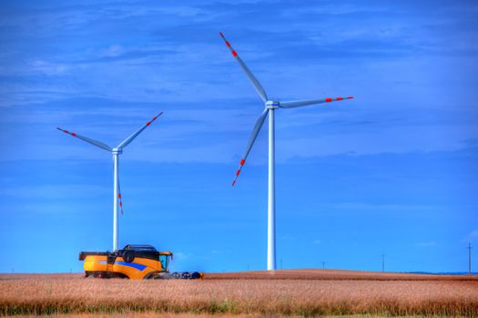 Modern agriculture. Wind turbines on the field