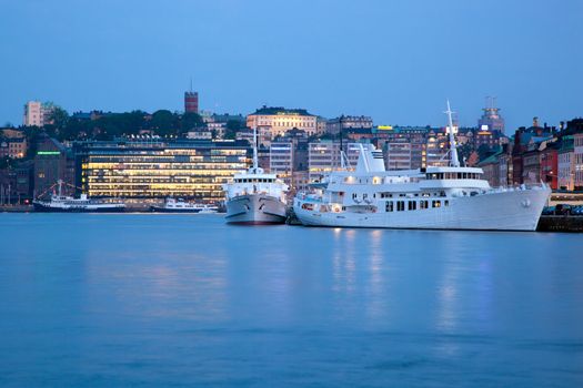 Stockholm, Sweden at night. Waterfront, ships, architecture