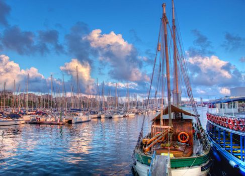 Boats in the harbor of Barcelona, Spain at sunset