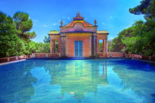 Summer park with water pool and relaxation place.