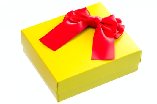Gift box with a red  ribbon bow isolated on white background.