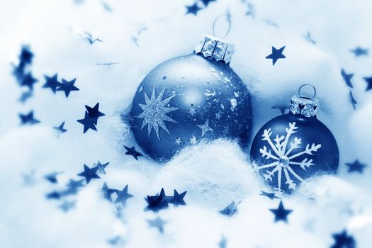 Christmas balls frozen in soft cotton wool resembling snow