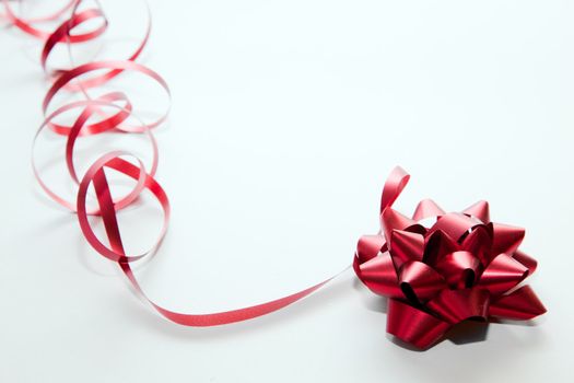 Christmas decoration. Red ribbon on white
