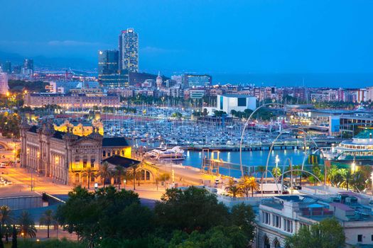 Barcelona, Spain skyline at night. Horbor view