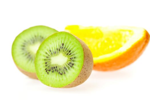 juicy kiwi and oranges isolated on white