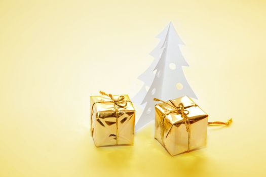 Christmas decoration made of paper tree and presents.
