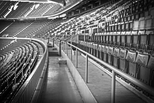 Empty football, soccer stadium grandstand in black and white