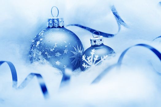 Christmas balls frozen in soft cotton wool resembling snow