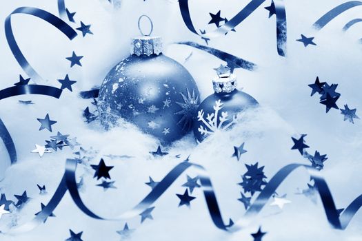 Christmas balls frozen in soft cotton wool resembling snow