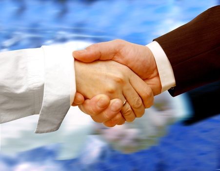 Business handshake on water background