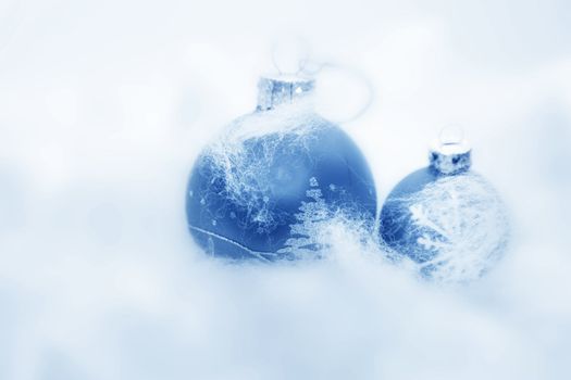 Christmas balls frozen in soft cotton wool resembling snow