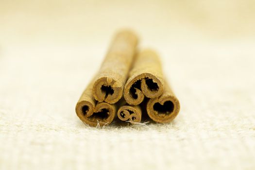 cinnamon sticks  on a wicker mat