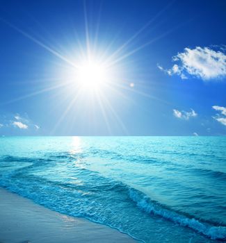 Tropical beach, sunny blue sky