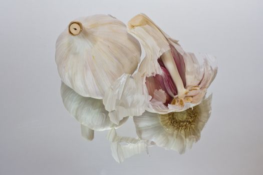 Cloves of garlic on a glass surface