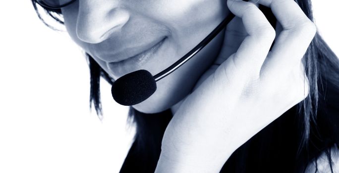 Friendly customer service agent smiling during telephone conversation